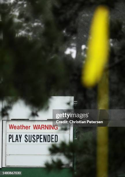 Message indicating that play is suspended is displayed during the third round of the 2023 Masters Tournament at Augusta National Golf Club on April...