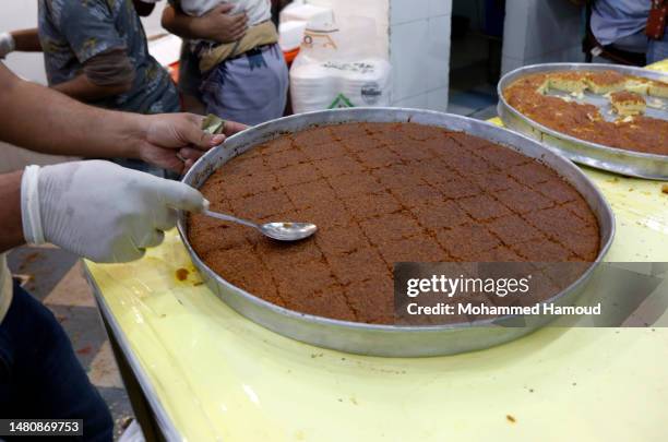 Yemenis shop for sweets during the holy Islamic month of Ramadan on April 08, 2023 in Sana'a, Yemen.