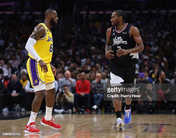 Kawhi Leonard of the LA Clippers is guarded by LeBron James of the Los Angeles Lakers during a 125-118 Clippers win at Crypto.com Arena on April 05,...