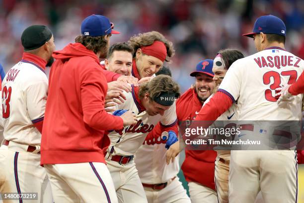 The Philadelphia Phillies celebrate a walk-off RBI single by Bryson Stott of the Philadelphia Phillies against the Cincinnati Reds at Citizens Bank...
