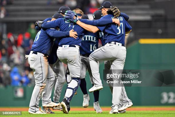 The Seattle Mariners infield players celebrate after defeating the Cleveland Guardians at Progressive Field on April 08, 2023 in Cleveland, Ohio. The...
