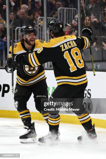 Pavel Zacha of the Boston Bruins celebrates with David Pastrnak after scoring a goal against the New Jersey Devils during the first period at TD...
