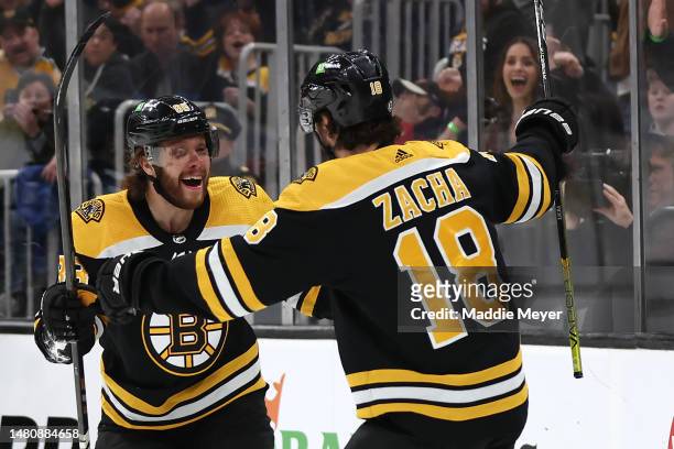 Pavel Zacha of the Boston Bruins celebrates with David Pastrnak after scoring a goal against the New Jersey Devils during the first period at TD...