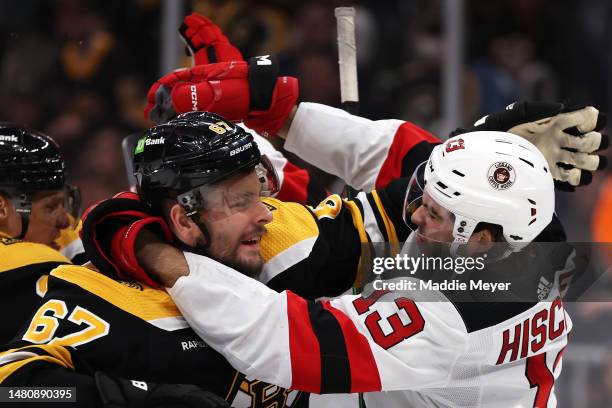 Nico Hischier of the New Jersey Devils and Jakub Zboril of the Boston Bruins fight during the second period at TD Garden on April 08, 2023 in Boston,...