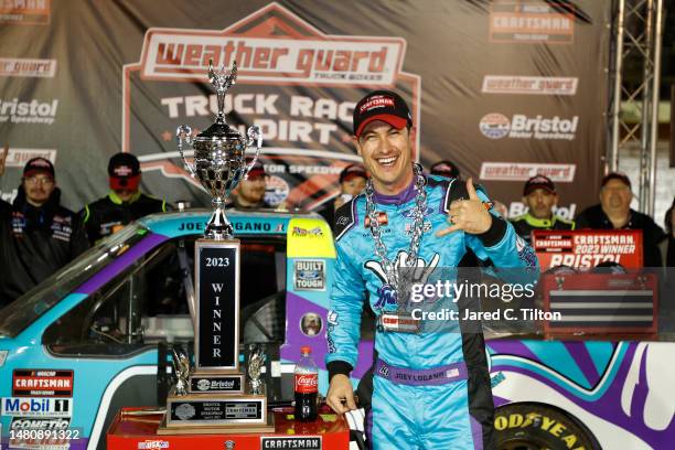 Joey Logano, driver of the Hang 10 Car Wash Ford, celebrates in victory lane after winning the NASCAR Craftsman Truck Series Weather Guard Truck Race...