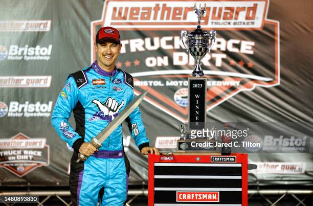 Joey Logano, driver of the Hang 10 Car Wash Ford, celebrates in victory lane after winning the NASCAR Craftsman Truck Series Weather Guard Truck Race...