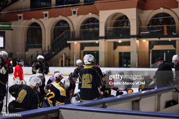 hockey, team training and coaching strategy, coach and talking about game plan, ice rink or group listening to advice. sports men, discussion or teamwork in practice, sport or fitness with ice hockey - hockey coach stock pictures, royalty-free photos & images