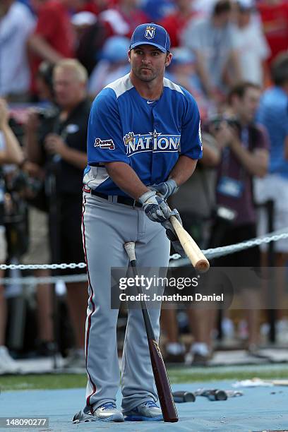 National League All-Star Dan Uggla of the Atlanta Braves warms up during the Gatorade All-Star Workout Day at Kauffman Stadium on July 9, 2012 in...