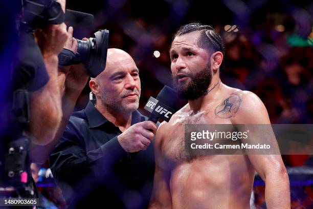 Jorge Masvidal speaks with UFC commentator Joe Rogan as he announces his retirement after his unanimous decision loss to Gilbert Burns of Brazil in...