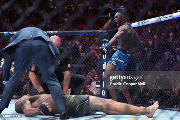 Israel Adesanya of Nigeria reacts after knocking out Alex Pereira of Brazil in the UFC middleweight championship fight during the UFC 287 event at...