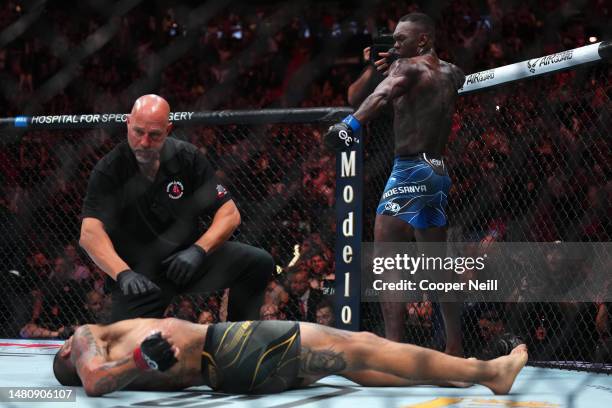 Israel Adesanya of Nigeria reacts after knocking out Alex Pereira of Brazil in the UFC middleweight championship fight during the UFC 287 event at...