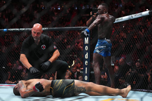 Israel Adesanya of Nigeria reacts after knocking out Alex Pereira of Brazil in the UFC middleweight championship fight during the UFC 287 event at...