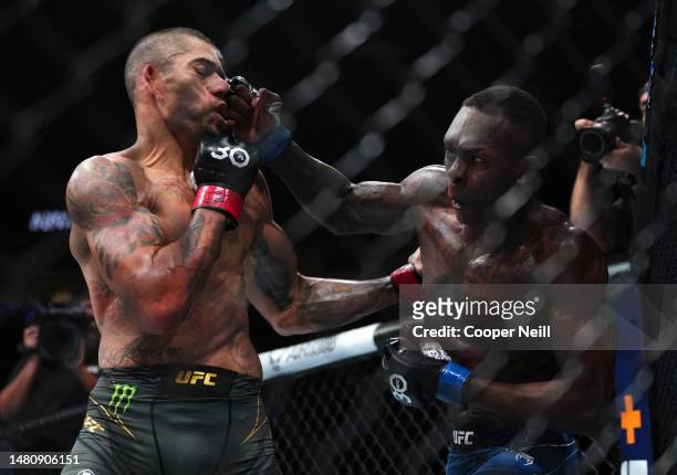 Israel Adesanya of Nigeria knocks out Alex Pereira of Brazil in the UFC middleweight championship fight during the UFC 287 event at Kaseya Center on...