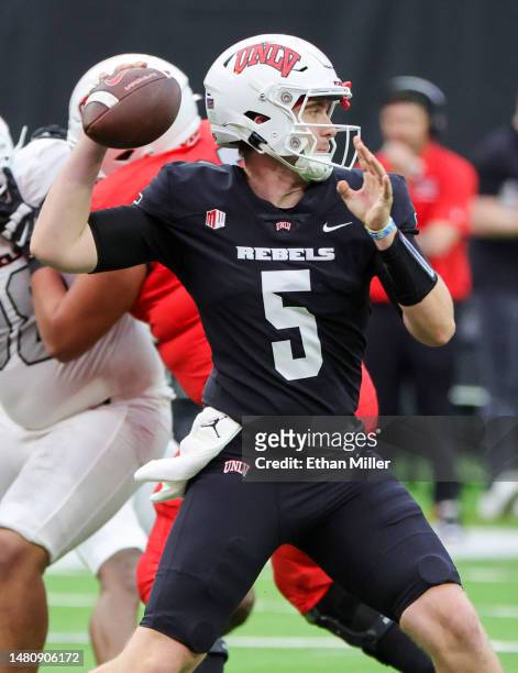 Quarterback Harrison Bailey of the UNLV Rebels throws a pass during the team's spring showcase scrimmage at Allegiant Stadium on April 08, 2023 in...
