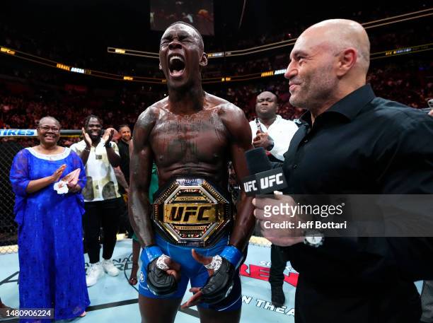 Israel Adesanya of Nigeria reacts after knocking out Alex Pereira of Brazil in the UFC middleweight championship fight during the UFC 287 event at...