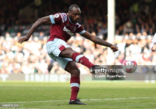 Michail Antonio of West Ham United shoots at goal during the Premier League match between Fulham FC and West Ham United at Craven Cottage on April...