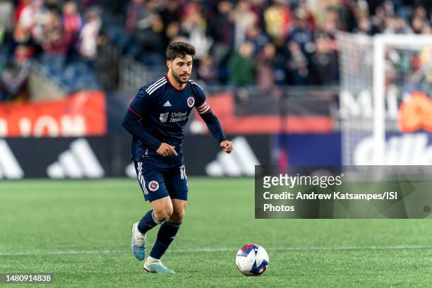 Carles Gil of New England Revolution brings the ball forward during a game between CF Montreal and New England Revolution at Gillette Stadium on...