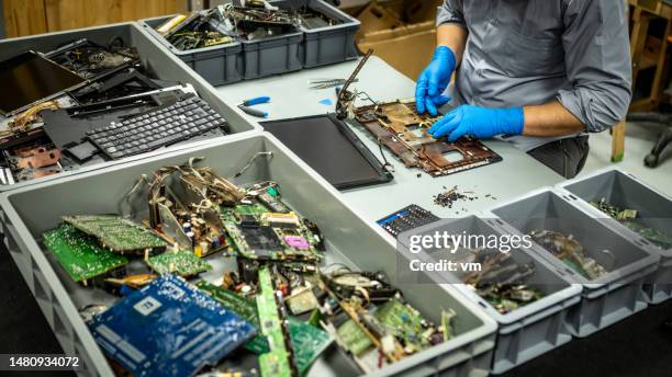 man in disposable gloves disassembling laptop - disassembled stock pictures, royalty-free photos & images