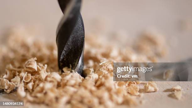 carpentry drill making hole in wooden plank - wood chip stock pictures, royalty-free photos & images