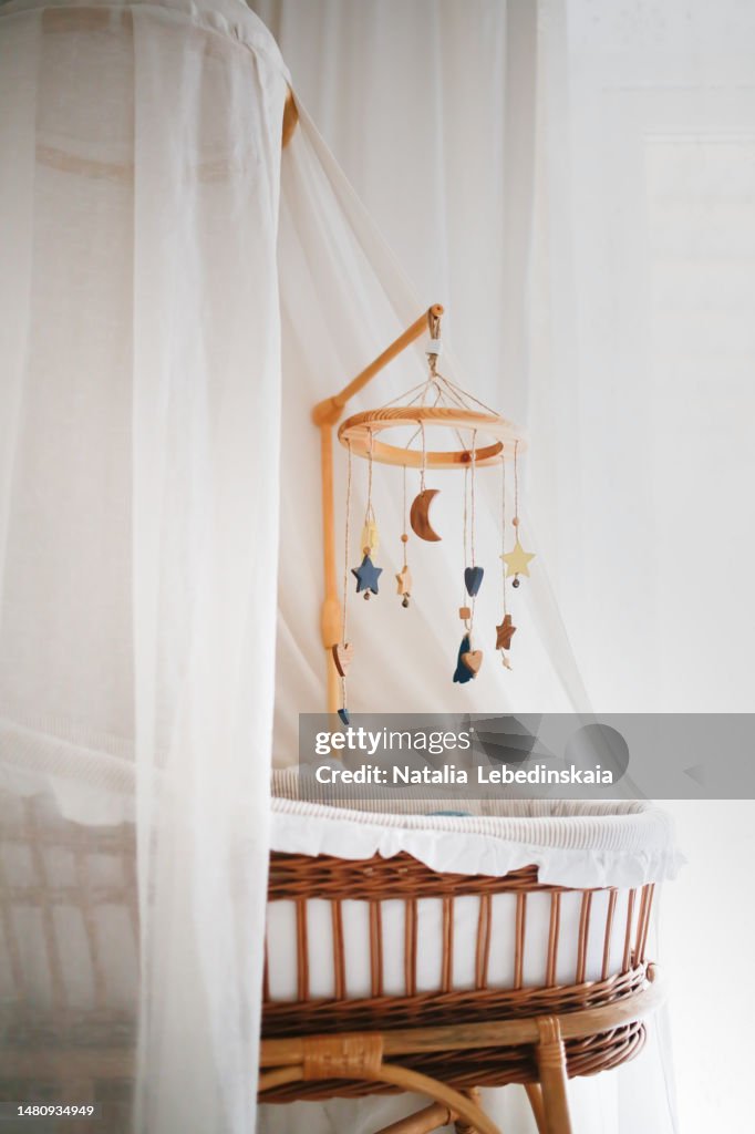 Preparing for the birth of a child. Waiting for baby concept. Cradle for newborn.