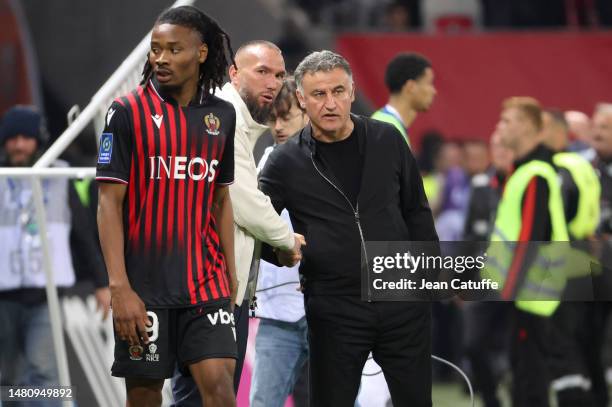 Coach of OGC Nice Didier Digard salutes coach of PSG Christophe Galtier while Khephren Thuram of Nice looks on following the Ligue 1 match between...