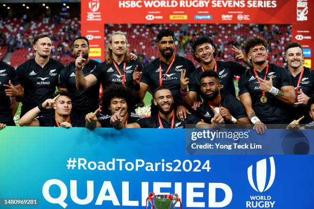 The New Zealand team celebrates after winning the cup final match against Argentina and qualifying for the Paris 2024 Olympic Games during the HSBC...