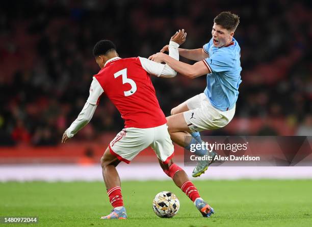 William Dickson of Manchester City is tackled by Lino Sousa of Arsenal during the FA Youth Cup Semi-Final match between Arsenal U18 and Manchester...