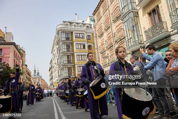 Several people play in a tamborrada maña that heads towards the Plaza Mayor, in Madrid, Spain. This Easter Tamborrada, in charge of the Cofradia La...