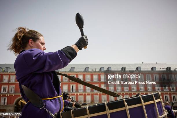 Woman plays in a tamborrada in the Plaza Mayor, in Madrid, Spain. This Holy Week Tamborrada, in charge of the Cofradia La Real, Muy ilustre y...