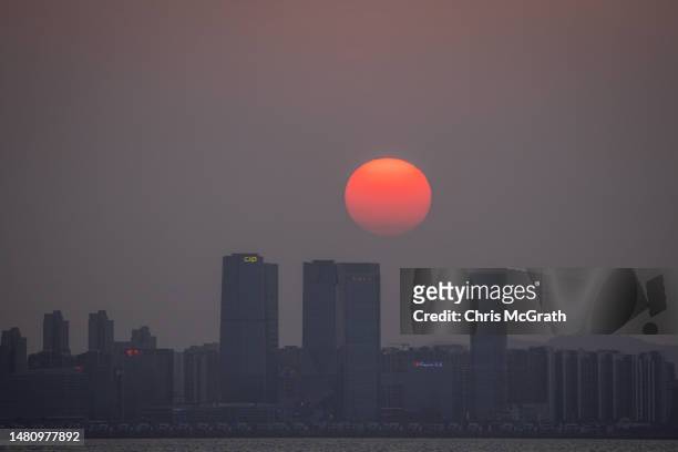 The sun sets over Chinese city Xiamen on April 09, 2023 in Kinmen, Taiwan. Kinmen, an island in the Taiwan strait that is part of Taiwan's territory,...
