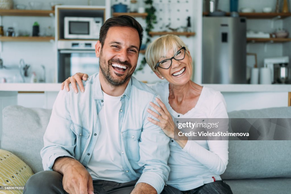 Happy couple at home.