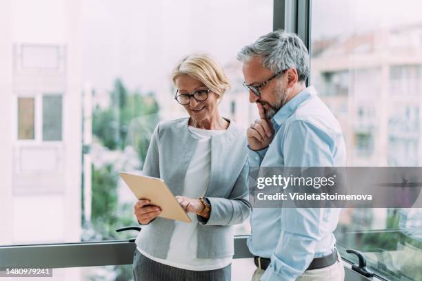 business people in the office. - middle age white woman stock pictures, royalty-free photos & images
