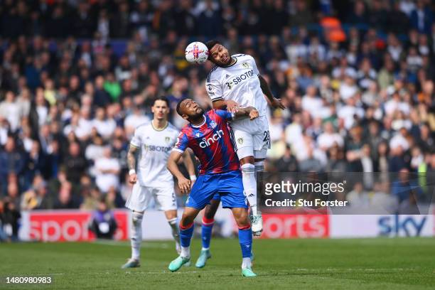 Weston McKennie of Leeds United wins a header against Jordan Ayew of Crystal Palace during the Premier League match between Leeds United and Crystal...