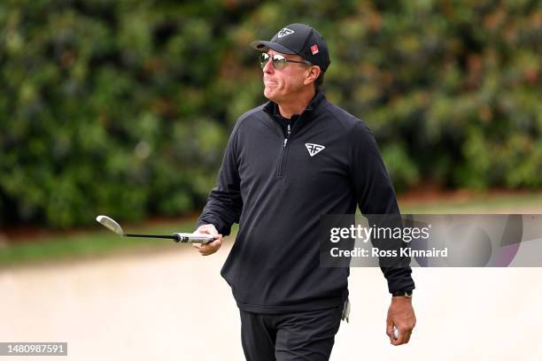 Phil Mickelson of the United States reacts on the 13th green during the continuation of the weather delayed third round of the 2023 Masters...