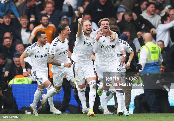 Patrick Bamford of Leeds United celebrates with teammates after scoring the teams first goal during the Premier League match between Leeds United and...