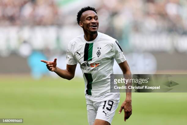 Nathan Ngoumou of Borussia Moenchengladbach celebrates after scoring the team's first goal during the Bundesliga match between Borussia...