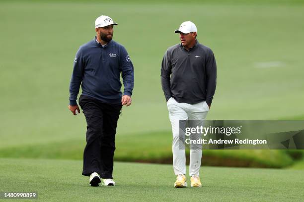 Jon Rahm of Spain and Brooks Koepka of the United States walk up the 13th fairway during the continuation of the weather delayed third round of the...