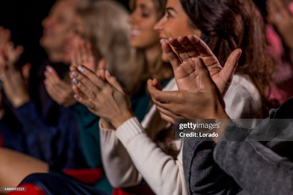 Small group of theatre going public at a performance