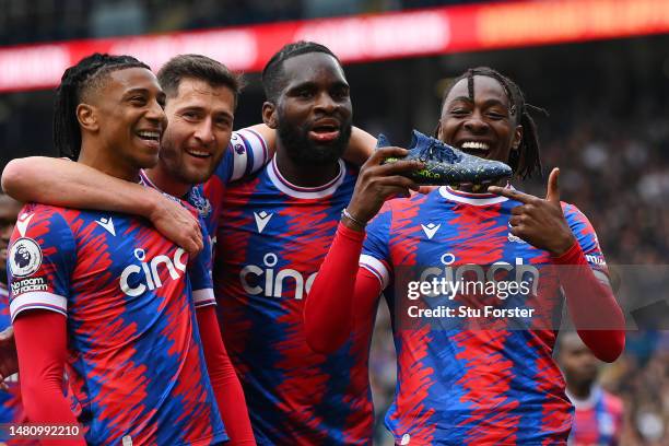 Eberechi Eze of Crystal Palace celebrates with teammates after scoring the team's third goal during the Premier League match between Leeds United and...