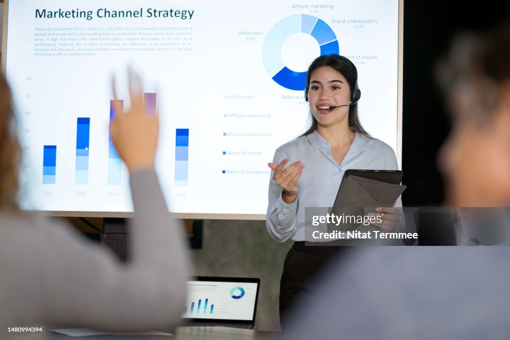 Launching New Products in the Market Creates an Awareness of the Product Among Consumers. Young Businesswoman sharing statistics and growth rate of market share to the attendees during a product launch live event.