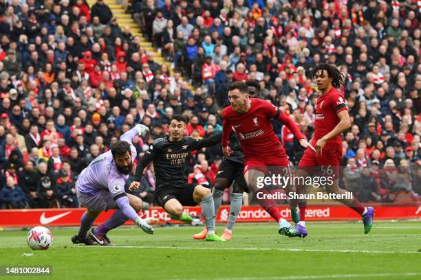 Gabriel Martinelli of Arsenal scores the team's first goal as Alisson Becker of Liverpool fails to make a save during the Premier League match...