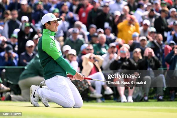 Viktor Hovland of Norway reacts to his putt on the 18th green during the continuation of the weather delayed third round of the 2023 Masters...