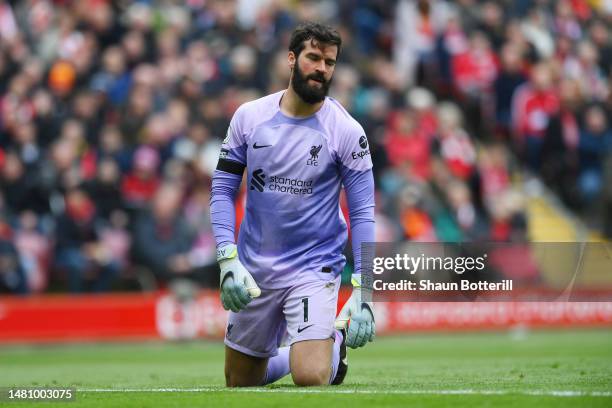 Alisson Becker of Liverpool looks dejected after Gabriel Martinelli of Arsenal scores the team's first goal during the Premier League match between...