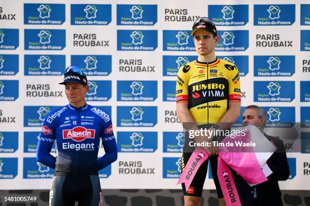 Race winner Mathieu van der Poel of The Netherlands and Team Alpecin-Deceuninck and Wout Van Aert of Belgium and Team Jumbo-Visma on third place pose...