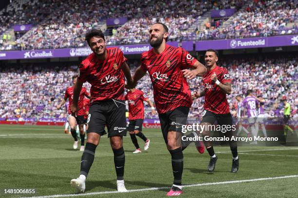 Vedat Muriqi of RCD Mallorca celebrates scoring their third goal with teammate Clement Grenier during the LaLiga Santander match between Real...