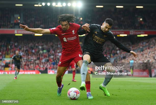 Trent Alexander-Arnold of Liverpool challenges Gabriel Martinelli of Arsenal during the Premier League match between Liverpool FC and Arsenal FC at...
