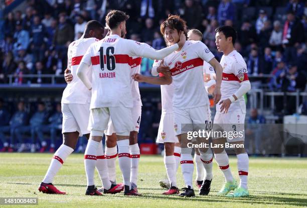 Hiroki Ito of VfB Stuttgart celebrates with teammates after scoring the team's first goal during the Bundesliga match between VfL Bochum 1848 and VfB...