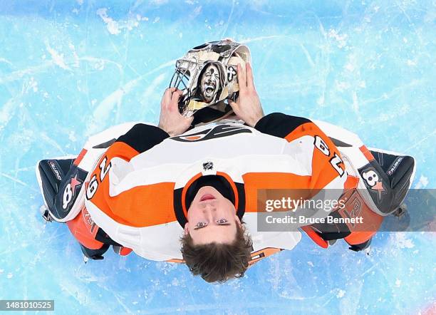 Carter Hart of the Philadelphia Flyers prepares to play against the New York Islanders at the UBS Arena on April 08, 2023 in Elmont, New York. The...