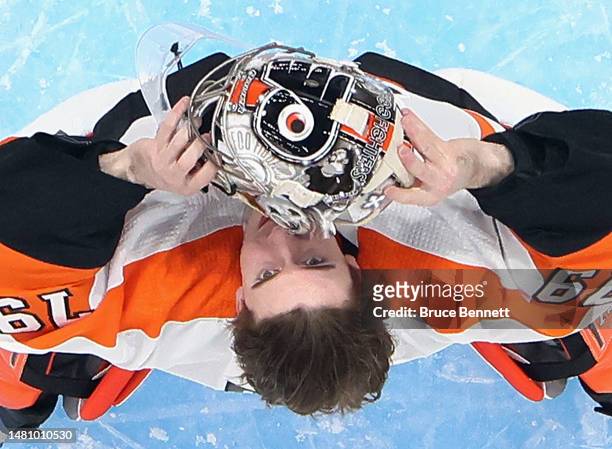 Carter Hart of the Philadelphia Flyers prepares to play against the New York Islanders at the UBS Arena on April 08, 2023 in Elmont, New York. The...