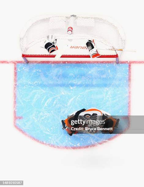 Carter Hart of the Philadelphia Flyers prepares to play against the New York Islanders at the UBS Arena on April 08, 2023 in Elmont, New York. The...